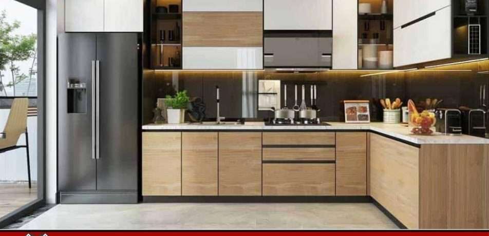 Pull-out pantry storage by Make Ready Homes beside fridge with neatly organized canned goods and groceries.