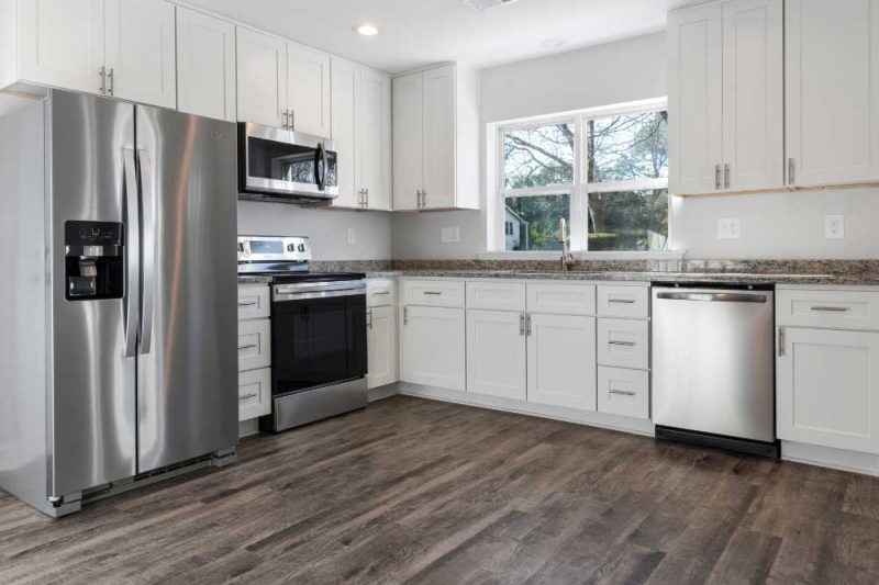 Make Ready Home fall kitchen update ideas featuring modern stainless steel appliances, granite counters, and bright space.
